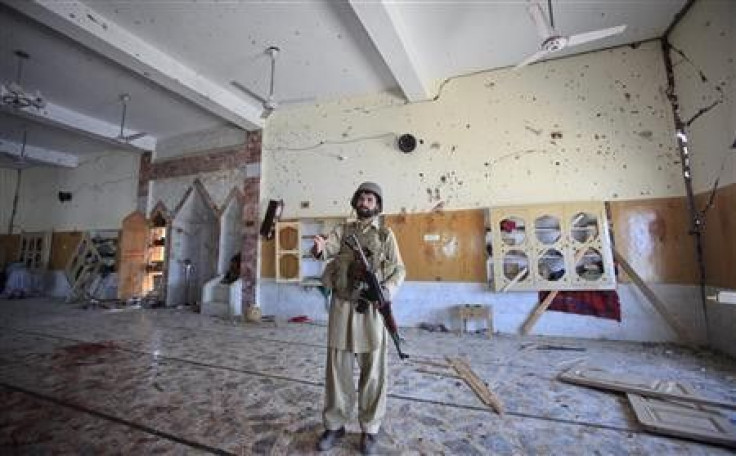 A paramilitary soldier secures the site of a sucide bomb attack inside a mosque in Jamrud, located in Pakistan&#039;s Khyber region