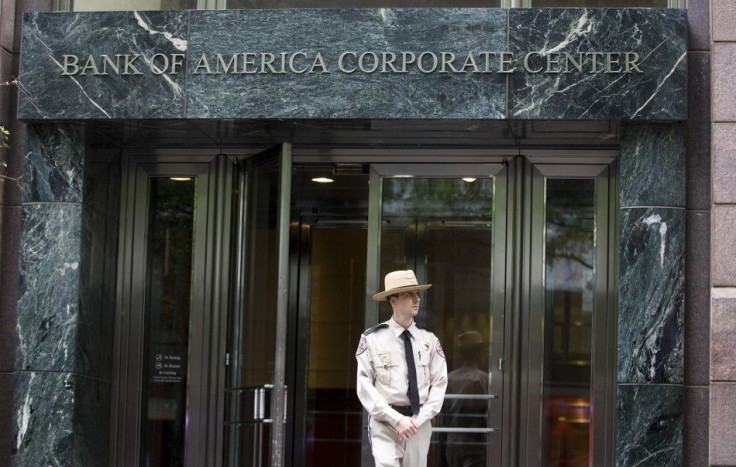 A private security guard keeps an eye on the sidewalk outside of the Bank of America Corporate Center in Charlotte
