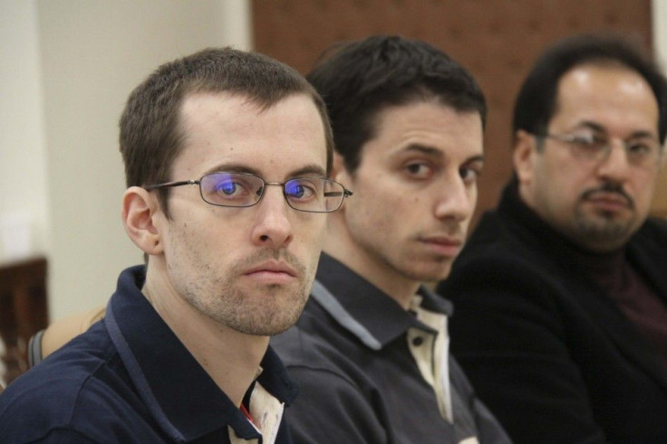 American hikers Shane Bauer (L) and Josh Fattal with their translator at the first session of their trial in Tehran