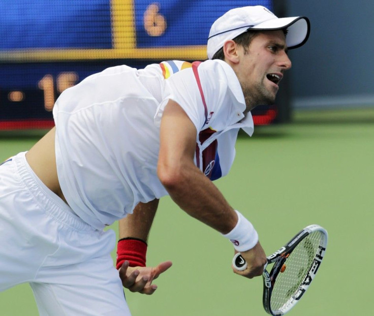 Djokovic of Serbia serves to Murray of Britain during their championship match at the Cincinnati Open tennis tournament