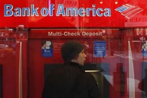 A customer uses an ATM machine inside of a Bank of America branch in Times Square in New York