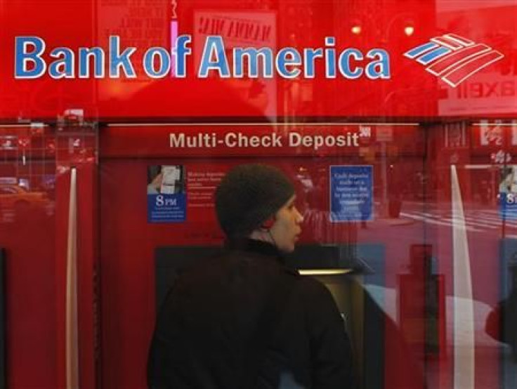 A customer uses an ATM machine inside of a Bank of America branch in Times Square in New York