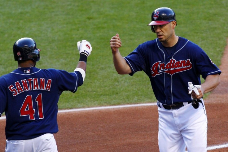 Cleveland Indians Hafner is greeted by Santana after scoring on an Toronto Blue Jays error during their MLB American League baseball game in Cleveland