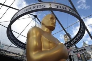An Oscar statue is seen beneath plastic sheeting during preparations for the 83rd Academy Awards in Hollywood, California