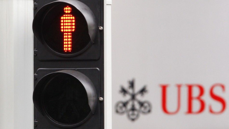 A traffic sign is seen next to an UBS logo in Zurich