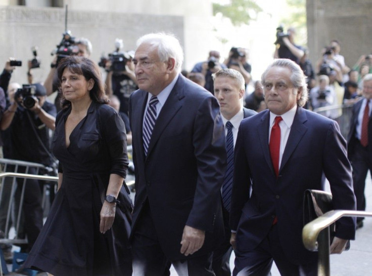 Former IMF chief Dominique Strauss-Kahn and his wife Anne Sinclair depart the New York State Supreme Courthouse in New York