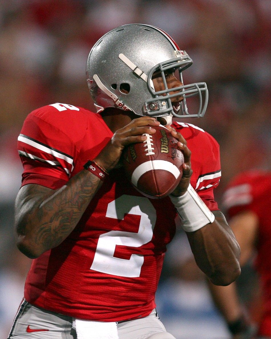 Ohio State University quarterback Terrelle Pryor 2 looks for a receiver against Marshall University during the second quarter of their NCAA football game in Columbus, Ohio, September 2, 2010.