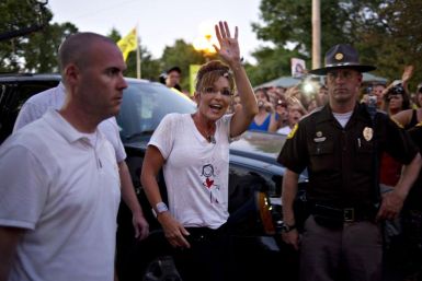 Former Alaska Governor Sarah Palin greets guests following a television appearance at the Iowa State Fair in Des Moines, Iowa