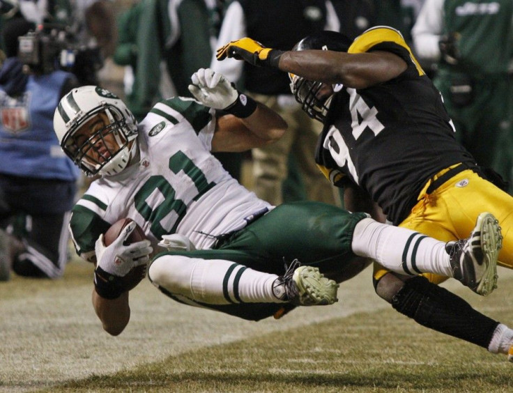 New York Jets tight end Keller is hit by Pittsburgh Steelers linebacker Timmons in the fourth quarter during the NFL AFC Championship football game in Pittsburgh