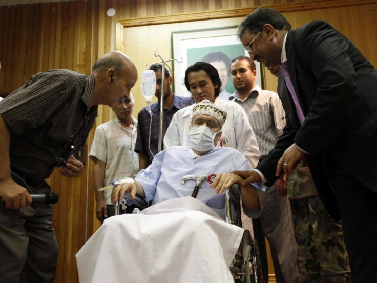 Abdel Basset al-Megrahi sits in a wheelchair in his room at a hospital in Tripoli