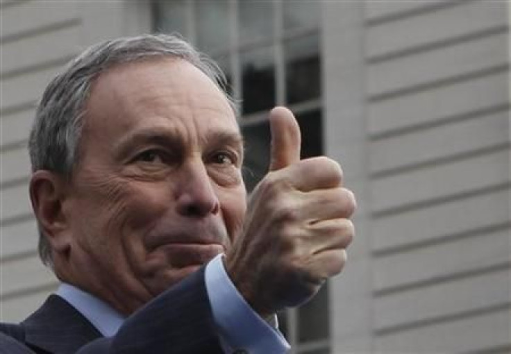 Mayor Bloomberg gestures to the crowd after taking the Oath of Office during his inauguration at New York&#039;s City Hall