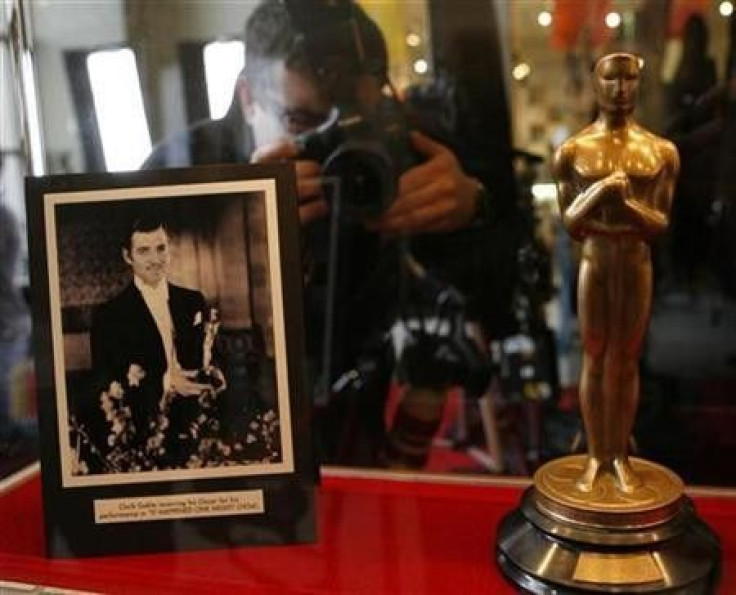 A photographer takes a picture of the 1934 Oscar awarded to Clark Gable for ''It Happened One Night'' at the ''Meet the Oscars, Chicago'' event