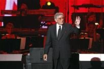 Tony Bennett waves after performing &#039;&#039;Smile&#039;&#039; at the 2011 MusiCares Person of the Year tribute honoring Barbra Streisand in Los Angeles