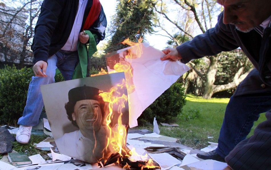 Army Hat Stolen, Symbolic Statue Attacked Gaddafi Pledges death or victory.