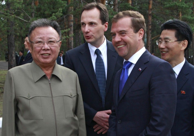 Russia's President Medvedev and North Korean leader Kim smile during their meeting at the "Sosnovyi Bor" military garrison in Siberia's Buryatia region