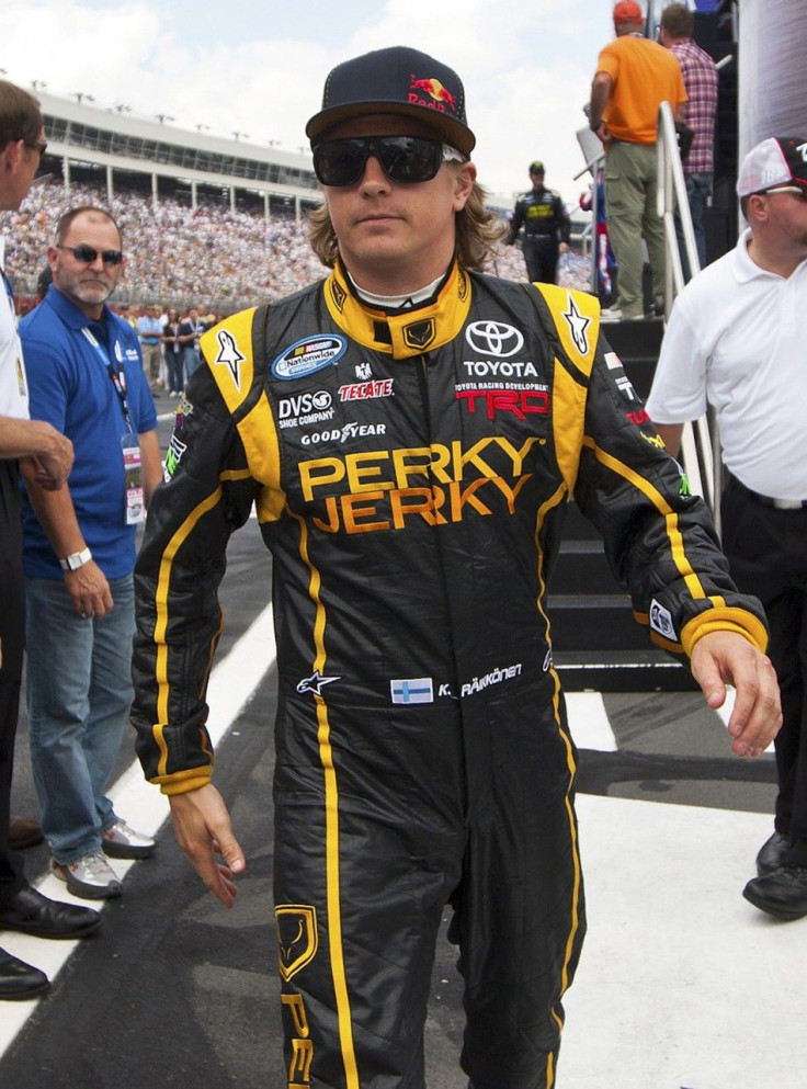 Kimi Raikkonen of Finland walks to his car after being introduced before the NASCAR Nationwide Series Top Gear 300 in North Carolina