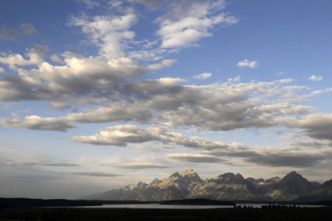 Morning sun hits the Grand Tetons as bankers and economists gather at the Jackson Hole Economic Symposium in Grand Teton National Park.