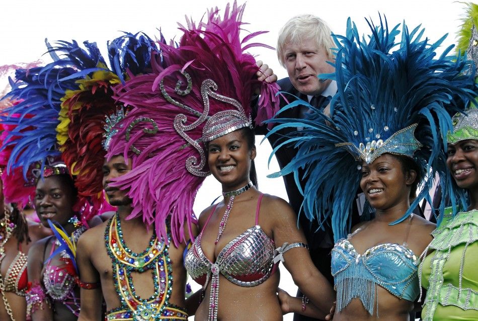London Mayor Boris Johnson joins dancers for a photocall to promote the Notting Hill Carnival at City Hall in London