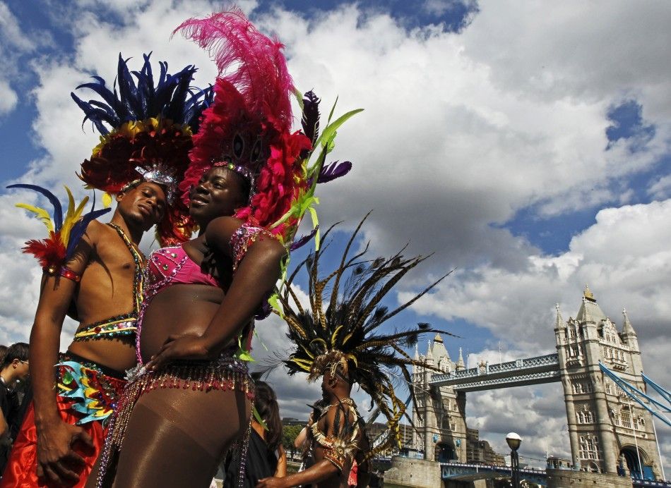Nicole Compton and Kendell Eugene L pose during a photocall to promote the Notting Hill Carnival at City Hall in London 