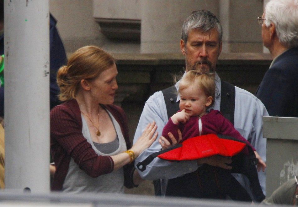 Actress Mireille Enos L walks beside her husband Alan Ruck and their daughter Vesper during filming of the zombie movie World War Z in Glasgow, Scotland