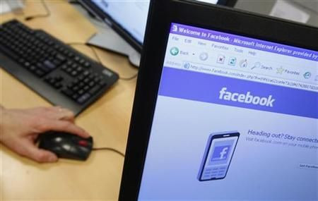 A Facebook page is displayed on a computer screen in Brussels
