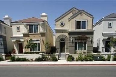 Row homes valued at $400,000 each, which are offered for free in a &quot;buy one, get one free&quot; deal, are seen in Escondido