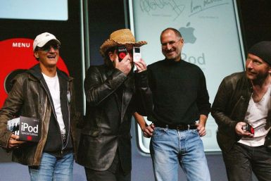 U2 lead singer Bono jokes as he stands with Apple CEO Steve Jobs and U2 guitarist The Edge during a news conference in San Jose.