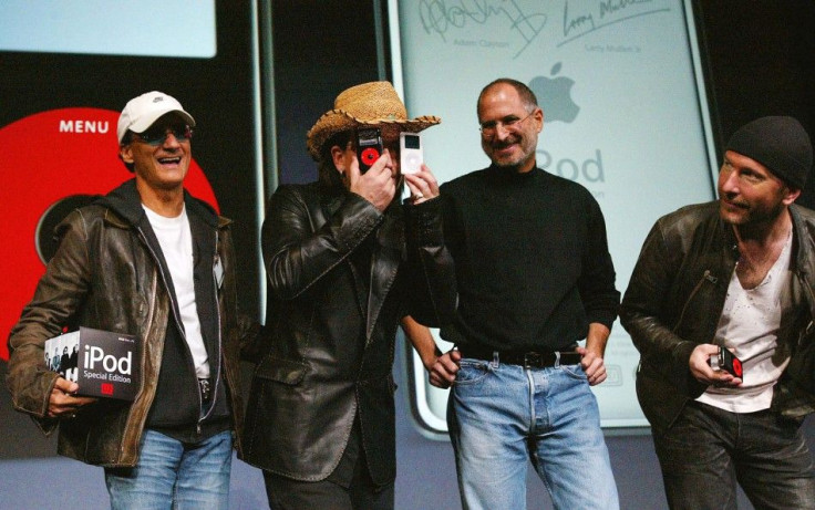 U2 lead singer Bono jokes as he stands with Apple CEO Steve Jobs and U2 guitarist The Edge during a news conference in San Jose.