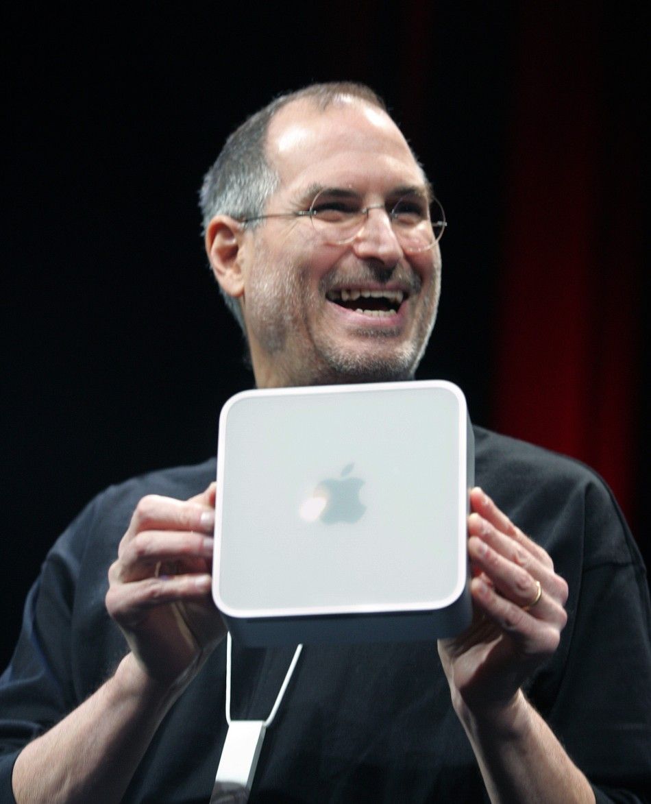 Apple CEO Steve Jobs holds up Apples new Mini Mac computer which he introduced at the Macworld Conference in San Francisco