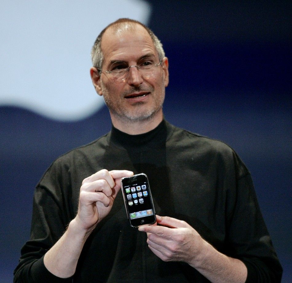 Apple Computer Inc. Chief Executive Officer Steve Jobs holds the new iPhone in San Francisco, California 