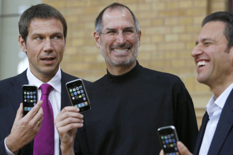 Deutsche Telekom AG Chief Executive Officer Rene Obermann, Apple Chief Executive Steve Jobs and T-Mobile Chief Executive Hamid Akhavan (L-R) pose for the media following their introduction of Apple's iPhone in Berlin 
