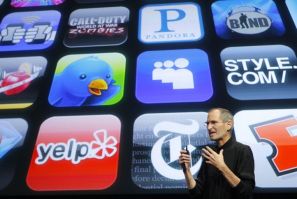 Apple Inc. CEO Steve Jobs speaks in front of the display showing buttons of various apps during the iPhone OS4 special event at Apple headquarters in Cupertino, California