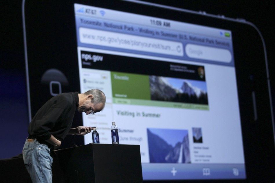 Apple CEO Steve Jobs bows after asking the audience to turn off WiFi devices, which were interfering with his presentation of the new iPhone 4, at the Apple Worldwide Developers Conference in San Francisco, California