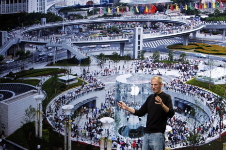 Apple Chief Executive Steve Jobs speaks on stage, with the Shanghai Apple store displayed on screen, at Apple's music-themed September media event in San Francisco, California 