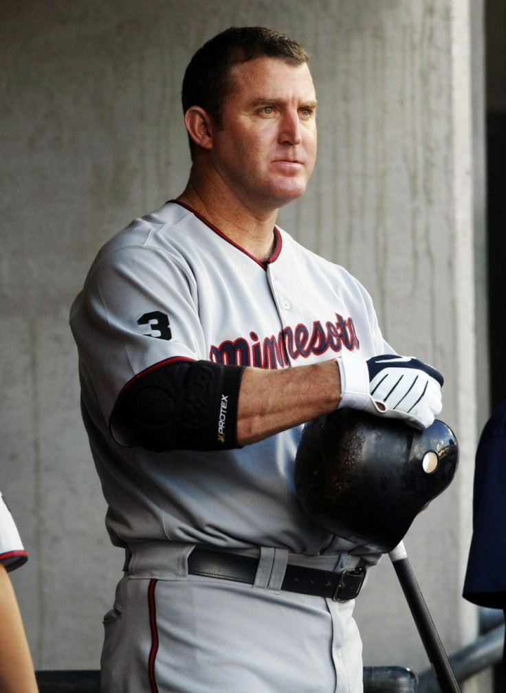 Minnesota Twins' Thome stands in the dug-out as he waits for his turn to bat during their MLB American League baseball game against the Detroit Tigers in Detroit