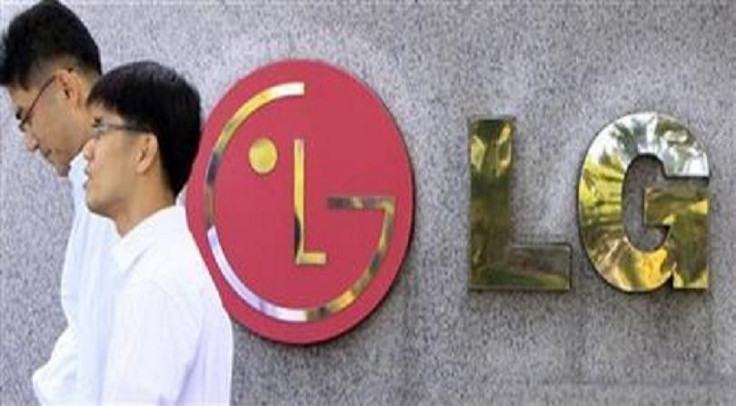 People walk past a company logo of LG Electronics in Seoul