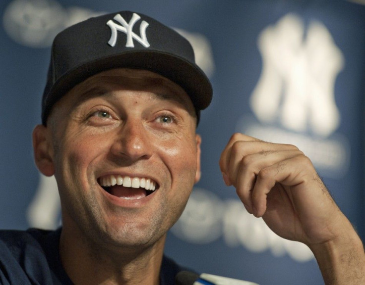 New York Yankees Derek Jeter laughs at a news conference after he got his 3,000th career hit in New York