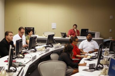 Officials at the American Red Cross in Greater New York Emergency Operations Center discuss their preparations for the landfall of Hurricane Irene in New York 