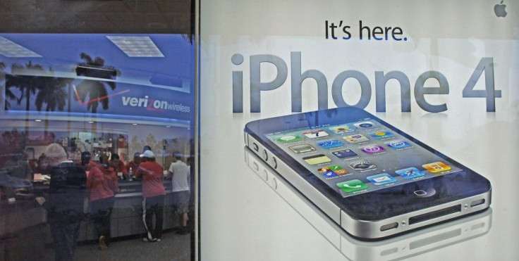 Customers purchase the iPhone 4 shortly after the phone went on sale with the Verizon Wireless network, in Boca Raton