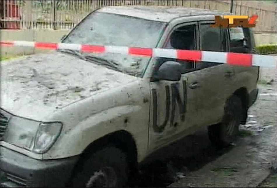 A damaged U.N. vehicle is seen after a bomb blast at the United Nations offices in the Nigerian capital of Abuja