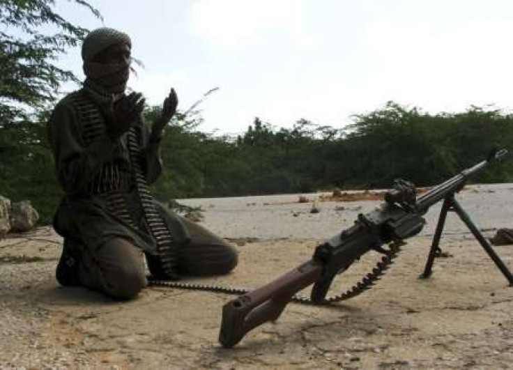 A hard-line Somali Islamist prays near a roadblock in southern Mogadishu September 18, 2009