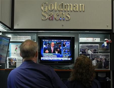 Traders work in the Goldman Sachs stall on the floor of the New York Stock Exchange