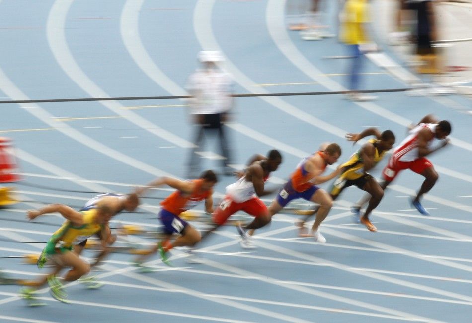 Competitors run during the 100 metres heat of the mens decathlon at the IAAF World Championships in Daegu
