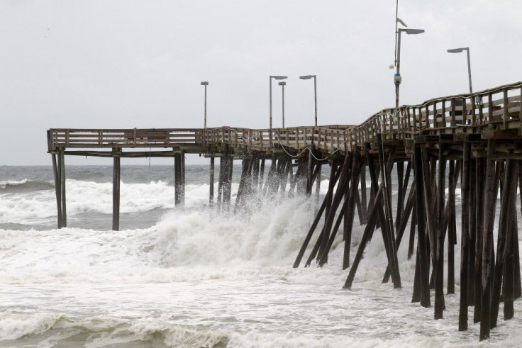 Waves hit the pier at Cape Hatteras National Seashore in Avon, North Carolina 