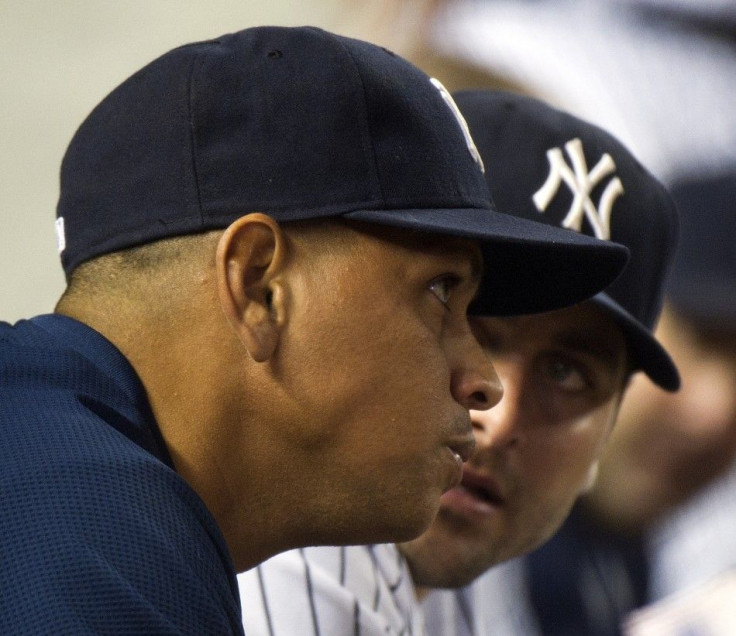New York Yankees Alex Rodriguez talks with catcher Francisco Cervelli on bench during the fifth inning of their MLB American League baseball game in New York