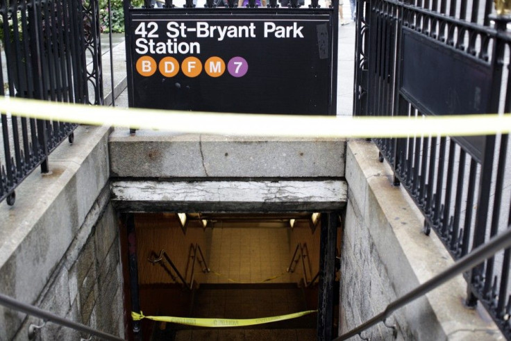 Yellow Caution tape blocks off an entrance to a closed subway station in New York