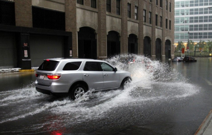 Car drives into a flooded area in lower Manhattan as Hurricane Irene closed in on New York City