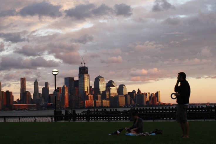 With the skyline of New York in the bakground, people enjoy the sunset along Hudson river after the pass of Hurricane Irene at Hoboken in New Jersey