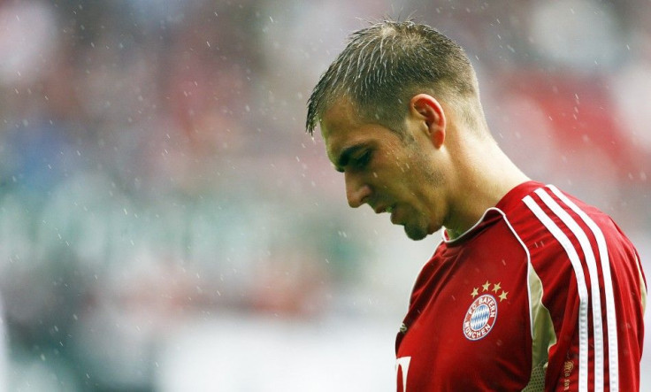 Munich's Lahm reacts before their German Bundesliga soccer match against Kaiserslautern in Kaiserslautern