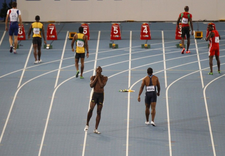 Usain Bolt of Jamaica reacts after being disqualified for a false start in the men&#039;s 100 metres final at the IAAF 2011 World Championship in Daegu